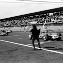 The flag man gets the race underway, led from pole position by Jo Siffert (SUI) Rob Walker Lotus 49B. Mexican Grand Prix, Mexico City, 3 November 1968
 © Sutton Motorsport Images