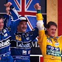 The podium in Mexico in 1992 (l to r): Riccardo Patrese (Williams, second); Nigel Mansell (Williams, winner); Michael Schumacher (Benetton, third). © Sutton Motorsport Images
