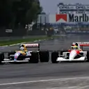 Nigel Mansell (GBR) Williams FW14 (left) and Ayrton Senna (BRA) McLaren MP4/6 battle for position. Mexican Grand Prix, Mexico City, 16 June 1991 © Sutton Motorsport Images
