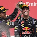 (L to R): Sebastian Vettel (GER) Red Bull Racing RB10 and race winner Daniel Ricciardo (AUS) Red Bull Racing celebrate on the podium with the champagne.
Formula One World Championship, Rd7, Canadian Grand Prix, Race Day, Montreal, Canada, Sunday 8 June 2014.

BEST IMAGE © Sutton Motorsport Images