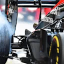Jenson Button (GBR) McLaren MP4-30 and tyre smoke at Formula One World Championship, Rd19, Abu Dhabi Grand Prix, Practice, Yas Marina Circuit, Abu Dhabi, UAE, Friday 27 November 2015. © Sutton Motorsport Images