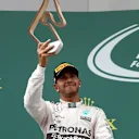 Lewis Hamilton (GBR) Mercedes AMG F1 celebrates with the tyrophy on the podium at Formula One World Championship, Rd8, Austrian Grand Prix, Race, Spielberg, Austria, Sunday 21 June 2015. © Sutton Motorsport Images