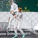 Race winner Nico Rosberg (GER) Mercedes AMG F1 celebrates with Lewis Hamilton (GBR) Mercedes AMG F1 and champagne on the podium at Formula One World Championship, Rd8, Austrian Grand Prix, Race, Spielberg, Austria, Sunday 21 June 2015. © Sutton Motorsport Images