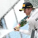 Nico Rosberg (GER) Mercedes AMG F1 celebrates with champagne on the podium at Formula One World Championship, Rd8, Austrian Grand Prix, Race, Spielberg, Austria, Sunday 21 June 2015. © Sutton Motorsport Images