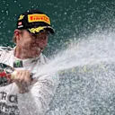 Race winner Nico Rosberg (GER) Mercedes AMG F1 celebrates with the champagne on the podium at Formula One World Championship, Rd8, Austrian Grand Prix, Race, Spielberg, Austria, Sunday 21 June 2015. © Sutton Motorsport Images