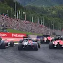 Jenson Button (GBR) McLaren MP4-30, Daniel Ricciardo (AUS) Red Bull Racing RB11 and Will Stevens (GBR) Marussia at the start of the race at Formula One World Championship, Rd8, Austrian Grand Prix, Race, Spielberg, Austria, Sunday 21 June 2015. © Sutton Motorsport Images