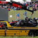 The car of race retiree Fernando Alonso (ESP) McLaren MP4-30 is recovered at Formula One World Championship, Rd8, Austrian Grand Prix, Race, Spielberg, Austria, Sunday 21 June 2015. © Sutton Motorsport Images