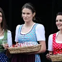 Formula Unas girls serving traditional food in the paddock at Formula One World Championship, Rd8, Austrian Grand Prix, Preparations, Spielberg, Austria, Thursday 18 June 2015. © Sutton Motorsport Images