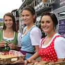 Austrian girls in traditional dress serving food in the paddock at Formula One World Championship, Rd8, Austrian Grand Prix, Preparations, Spielberg, Austria, Thursday 18 June 2015. © Sutton Motorsport Images