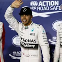 (L to R): Sebastian Vettel (GER) Ferrari, pole sitter Lewis Hamilton (GBR) Mercedes AMG F1 and Nico Rosberg (GER) Mercedes AMG F1 celebrate in parc ferme at Formula One World Championship, Rd4, Bahrain Grand Prix Qualifying, Bahrain International Circuit, Sakhir, Bahrain, Saturday 18  April 2015. © Sutton Motorsport Images