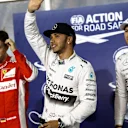 (L to R): Sebastian Vettel (GER) Ferrari, pole sitter Lewis Hamilton (GBR) Mercedes AMG F1 and Nico Rosberg (GER) Mercedes AMG F1 celebrate in parc ferme at Formula One World Championship, Rd4, Bahrain Grand Prix Qualifying, Bahrain International Circuit, Sakhir, Bahrain, Saturday 18  April 2015. © Sutton Motorsport Images