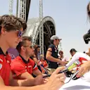 Roberto Merhi (ESP) and Will Stevens (GBR) Marussia signs autographs for the fans at Formula One World Championship, Rd4, Bahrain Grand Prix Qualifying, Bahrain International Circuit, Sakhir, Bahrain, Saturday 18  April 2015. © Sutton Motorsport Images