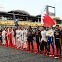 Drivers observe the National Anthem on the grid at Formula One World Championship, Rd4, Bahrain Grand Prix Race, Bahrain International Circuit, Sakhir, Bahrain, Sunday 19  April 2015. © Sutton Motorsport Images