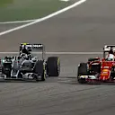 Nico Rosberg (GER) Mercedes AMG F1 W06 and Sebastian Vettel (GER) Ferrari SF15-T battle at Formula One World Championship, Rd4, Bahrain Grand Prix Race, Bahrain International Circuit, Sakhir, Bahrain, Sunday 19  April 2015. © Sutton Motorsport Images