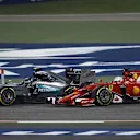 Nico Rosberg (GER) Mercedes AMG F1 W06 and Sebastian Vettel (GER) Ferrari SF15-T battle at Formula One World Championship, Rd4, Bahrain Grand Prix Race, Bahrain International Circuit, Sakhir, Bahrain, Sunday 19  April 2015. © Sutton Motorsport Images
