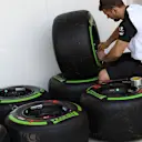 A McLaren machnic prepare a green colored intermediate Pirelli tyre at Formula One World Championship, Rd4, Bahrain Grand Prix Preparations, Bahrain International Circuit, Sakhir, Bahrain, Thursday 16  April 2015. © Sutton Motorsport Images