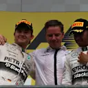 Nico Rosberg (GER) Mercedes AMG F1 and race winner Lewis Hamilton (GBR) Mercedes AMG F1 celebrate on the podium at Formula One World Championship, Rd11, Belgian Grand Prix, Race, Spa Francorchamps, Belgium, Sunday 23 August 2015. © Sutton Motorsport Images