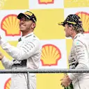Lewis Hamilton (GBR) Mercedes AMG F1 and Nico Rosberg (GER) Mercedes AMG F1 celebrate on the podium with the champagne at Formula One World Championship, Rd11, Belgian Grand Prix, Race, Spa Francorchamps, Belgium, Sunday 23 August 2015. © Sutton Motorsport Images