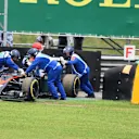 The car of Fernando Alonso (ESP) McLaren MP4-30 is recovered after stopping on track in Q1 at Formula One World Championship, Rd18, Brazilian Grand Prix, Qualifying, Interlagos, Sao Paulo, Brazil, Saturday 14 November 2015. © Sutton Motorsport Images