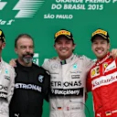 (L to R): Lewis Hamilton (GBR) Mercedes AMG F1, James Waddell (GBR) Mercedes AMG F1 Race Team Composite Technician, race winner Nico Rosberg (GER) Mercedes AMG F1 and Sebastian Vettel (GER) Ferrari celebrate on the podium at Formula One World Championship, Rd18, Brazilian Grand Prix, Race, Interlagos, Sao Paulo, Brazil, Sunday 15 November 2015. © Sutton Motorsport Images