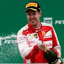 Sebastian Vettel (GER) Ferrari celebrates with the champagne on the podium at Formula One World Championship, Rd18, Brazilian Grand Prix, Race, Interlagos, Sao Paulo, Brazil, Sunday 15 November 2015. © Sutton Motorsport Images