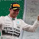 Race winner Nico Rosberg (GER) Mercedes AMG F1 celebrates with the champagne on the podium at Formula One World Championship, Rd18, Brazilian Grand Prix, Race, Interlagos, Sao Paulo, Brazil, Sunday 15 November 2015. © Sutton Motorsport Images