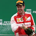 Sebastian Vettel (GER) Ferrari celebrates on the podium with the champagne at Formula One World Championship, Rd18, Brazilian Grand Prix, Race, Interlagos, Sao Paulo, Brazil, Sunday 15 November 2015. © Sutton Motorsport Images