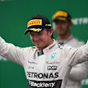 Race winner Nico Rosberg (GER) Mercedes AMG F1 celebrates on the podium at Formula One World Championship, Rd18, Brazilian Grand Prix, Race, Interlagos, Sao Paulo, Brazil, Sunday 15 November 2015. © Sutton Motorsport Images
