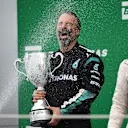 James Waddell (GBR) Mercedes AMG F1 Race Team Composite Technician celebrates with the Constructors trophy and the champagne on the podium at Formula One World Championship, Rd18, Brazilian Grand Prix, Race, Interlagos, Sao Paulo, Brazil, Sunday 15 November 2015. © Sutton Motorsport Images