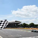 Nico Rosberg (GER) Mercedes AMG F1 W06 takes the chequered flag at the end of Qualifying at Formula One World Championship, Rd9, British Grand Prix, Qualifying, Silverstone, England, Saturday 4 July 2015. © Sutton Motorsport Images