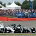Lewis Hamilton (GBR) Mercedes AMG F1 W06 battles with Valtteri Bottas (FIN) Williams FW37 at the start of the race at Formula One World Championship, Rd9, British Grand Prix, Race, Silverstone, England, Sunday 5 July 2015. © Sutton Motorsport Images