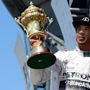 Race winner Lewis Hamilton (GBR) Mercedes AMG F1 celebrates in with the trophy on the podium at Formula One World Championship, Rd9, British Grand Prix, Race, Silverstone, England, Sunday 5 July 2015. © Sutton Motorsport Images
