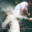 Race winner Lewis Hamilton (GBR) Mercedes AMG F1 and 2nd places Nico Rosberg (GER) Mercedes AMG F1 celebrate with the champagne on the podium at Formula One World Championship, Rd9, British Grand Prix, Race, Silverstone, England, Sunday 5 July 2015. © Sutton Motorsport Images