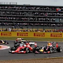 Sebastian Vettel (GER) Ferrari SF15-T and Daniil Kvyat (RUS) Red Bull Racing RB11 battle at Formula One World Championship, Rd9, British Grand Prix, Race, Silverstone, England, Sunday 5 July 2015. © Sutton Motorsport Images