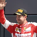 Sebastian Vettel (GER) Ferrari celebrates on the podium at Formula One World Championship, Rd9, British Grand Prix, Race, Silverstone, England, Sunday 5 July 2015. © Sutton Motorsport Images