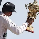 Race winner Lewis Hamilton (GBR) Mercedes AMG F1 celebrates with the trophy on the podium at Formula One World Championship, Rd9, British Grand Prix, Race, Silverstone, England, Sunday 5 July 2015. © Sutton Motorsport Images