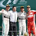 (L to R): Nico Rosberg (GER) Mercedes AMG F1, Peter Bonnington (GBR) Mercedes AMG F1 race engineer, race winner Lewis Hamilton (GBR) Mercedes AMG F1 and Sebastian Vettel (GER) Ferrari celebrate on the podium at Formula One World Championship, Rd9, British Grand Prix, Race, Silverstone, England, Sunday 5 July 2015. © Sutton Motorsport Images