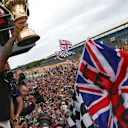 Race winner Lewis Hamilton (GBR) Mercedes AMG F1 celebrates with fans and trophy at Formula One World Championship, Rd9, British Grand Prix, Race, Silverstone, England, Sunday 5 July 2015. © Sutton Motorsport Images