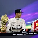 Nico Rosberg (GER) Mercedes AMG F1, Lewis Hamilton (GBR) Mercedes AMG F1 and Sebastian Vettel (GER) Ferrari in the press conference with the trophy   at Formula One World Championship, Rd9, British Grand Prix, Race, Silverstone, England, Sunday 5 July 2015. © Sutton Motorsport Images