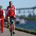 Sebastian Vettel (GER) Ferrari rides a bike at Formula One World Championship, Rd7, Canadian Grand Prix, Qualifying, Montreal, Canada, Saturday 6 June 2015. © Sutton Motorsport Images