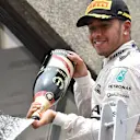 Race winner Lewis Hamilton (GBR) Mercedes AMG F1 celebrates on the Podium with the champagne at Formula One World Championship, Rd7, Canadian Grand Prix, Race, Montreal, Canada, Sunday 7 June 2015. © Sutton Motorsport Images