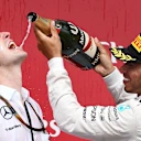 Race winner Lewis Hamilton (GBR) Mercedes AMG F1 celebrates with Riccardo Mosconi (ITA) Mercedes AMG F1 Data Engineer and the champagne on the podium at Formula One World Championship, Rd7, Canadian Grand Prix, Race, Montreal, Canada, Sunday 7 June 2015. © Sutton Motorsport Images