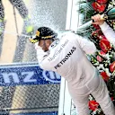 Lewis Hamilton (GBR) Mercedes AMG F1 and Nico Rosberg (GER) Mercedes AMG F1 celebrate with the champagne on the podium at Formula One World Championship, Rd3, Chinese Grand Prix, Race, Shanghai, China, Sunday 12 April 2015. © Sutton Motorsport Images
