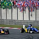Daniel Ricciardo (AUS) Red Bull Racing RB11 and Marcus Ericsson (SWE) Sauber C34 battle at Formula One World Championship, Rd3, Chinese Grand Prix, Race, Shanghai, China, Sunday 12 April 2015. © Sutton Motorsport Images