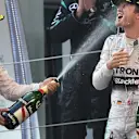 Lewis Hamilton (GBR) Mercedes AMG F1 and Nico Rosberg (GER) Mercedes AMG F1 celebrate on the podium with the champagne Formula One World Championship, Rd3, Chinese Grand Prix, Race, Shanghai, China, Sunday 12 April 2015. © Sutton Motorsport Images