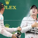 Race winner Lewis Hamilton (GBR) Mercedes AMG F1 celebrates with Nico Rosberg (GER) Mercedes AMG F1 and champagne on the podium at Formula One World Championship, Rd3, Chinese Grand Prix, Race, Shanghai, China, Sunday 12 April 2015. © Sutton Motorsport Images