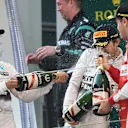 Nico Rosberg (GER) Mercedes AMG F1, Lewis Hamilton (GBR) Mercedes AMG F1 and Sebastian Vettel (GER) Ferrari celebrate on the podium with champagne at Formula One World Championship, Rd3, Chinese Grand Prix, Race, Shanghai, China, Sunday 12 April 2015. © Sutton Motorsport Images