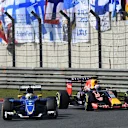 Marcus Ericsson (SWE) Sauber C34 and Daniel Ricciardo (AUS) Red Bull Racing RB11 battle at Formula One World Championship, Rd3, Chinese Grand Prix, Race, Shanghai, China, Sunday 12 April 2015. © Sutton Motorsport Images