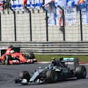 Nico Rosberg (GER) Mercedes AMG F1 W06 leads Sebastian Vettel (GER) Ferrari SF15-T at Formula One World Championship, Rd3, Chinese Grand Prix, Race, Shanghai, China, Sunday 12 April 2015. © Sutton Motorsport Images