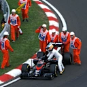 Marshalls and Fernando Alonso (ESP) McLaren MP4-30 push his car in Q2 at Formula One World Championship, Rd10, Hungarian Grand Prix, Qualifying, Hungaroring, Hungary, Saturday 25 July 2015. © Sutton Motorsport Images